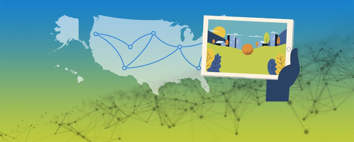 Hand holding a tablet with the United States in the background